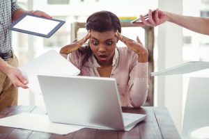 47404484 - businesswoman stressed out at work in casual office